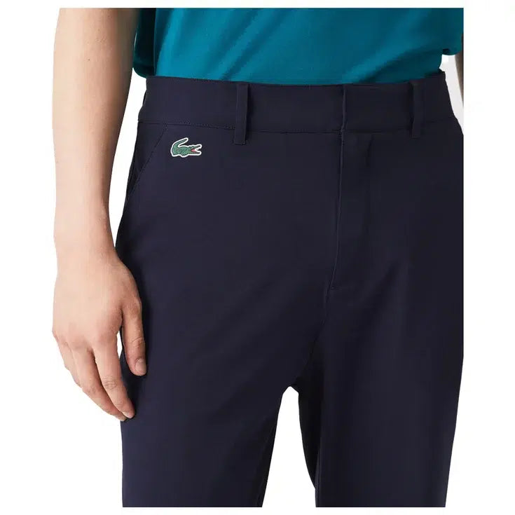 pantalon golf lacoste golf club bleu marine porté